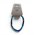 CCBeadsandBeyondLLC blue tear drop bracelet made of polymer clay heishi beads in various shades of blue.
