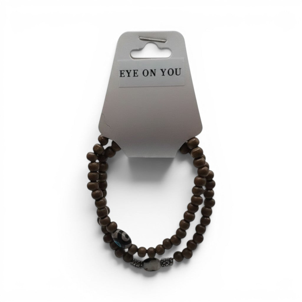 CCBeadsandBeyondLLC brown wooden beaded bracelet with evil eye charm and accent beads.