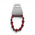 CCBeadsandBeyondLLC cherry red beaded bracelet with silver accents and varying bead sizes.