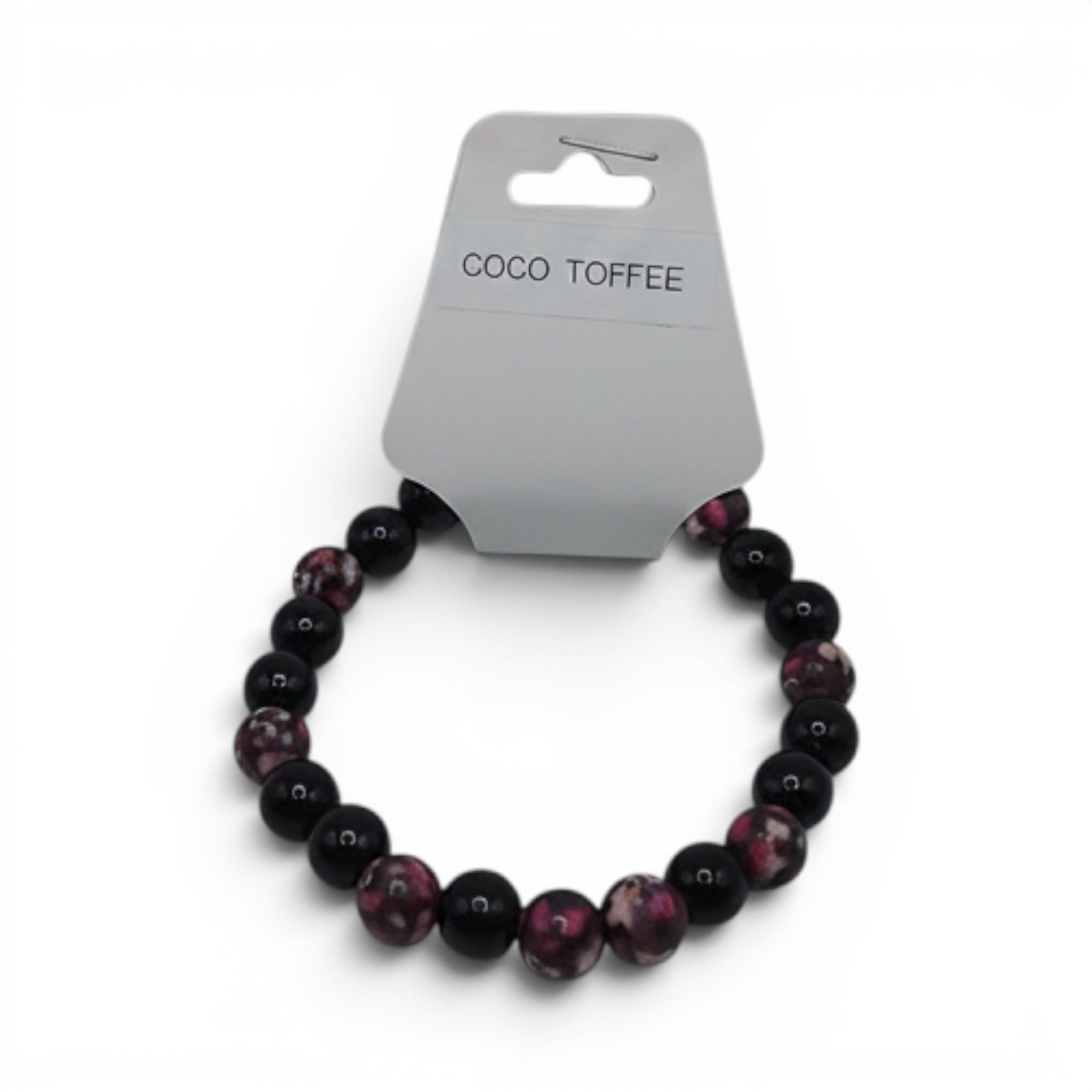 CCBeadsandBeyondLLC Coco Toffee bracelet with black and pink marbled beads on a white background.
