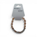CCBeadsandBeyondLLC Eggshell Honey bracelet with oval peach beads and faceted brown beads.