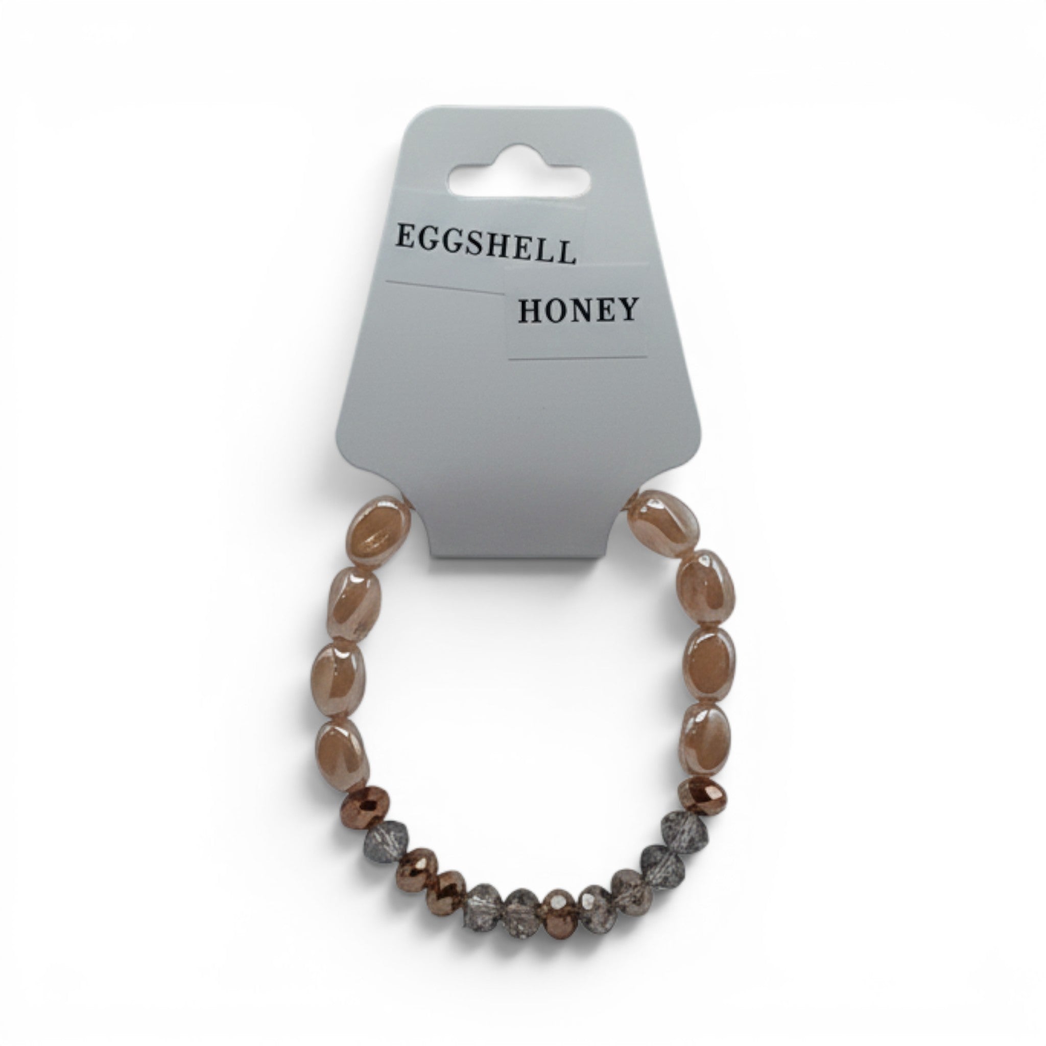 CCBeadsandBeyondLLC Eggshell Honey bracelet with oval peach beads and faceted brown beads.