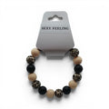 CCBeadsandBeyondLLC bracelet with beige, black, and leopard print beads. Features large, round beads.