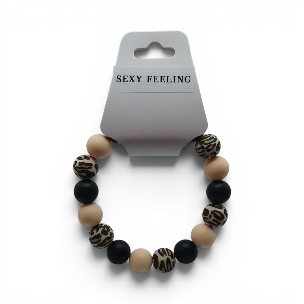 CCBeadsandBeyondLLC bracelet with beige, black, and leopard print beads. Features large, round beads.