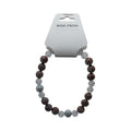 CCBeadsandBeyondLLC Miss Priss beaded bracelet with brown, silver, and clear beads. Features spiral and star designs.
