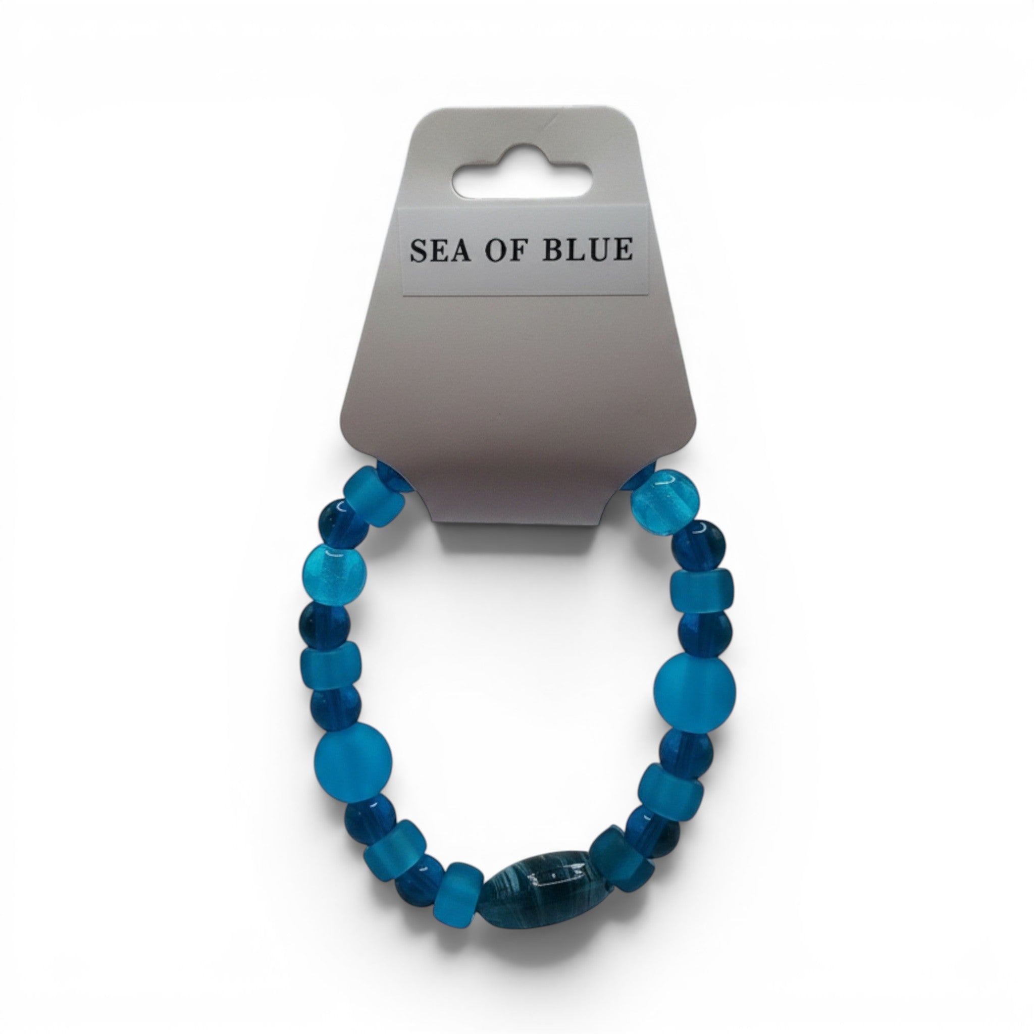 CCBeadsandBeyondLLC Sea Of Blue elastic bracelet with assorted blue glass beads and a striped focal bead.