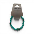 CCBeadsandBeyondLLC Simplistic bracelet with turquoise and green jade beads, featuring a carved green bead accent.