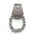 CCBeadsandBeyondLLC white beaded bracelet with clear textured beads and rhinestone accents. "Purity" tag.