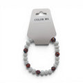 CCBeadsandBeyondLLC white beaded bracelet with colorful striped accent beads.