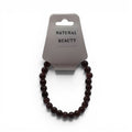 CCBeadsandBeyondLLCHere Natural Beauty bracelet with deep red garnet beads on a white background.